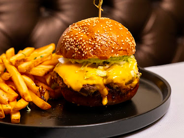The Hidden House signature dishes Wagyu Smash Burger
Kashmiri Chili Shrimp Skewers
Prime Grade Pork Chop